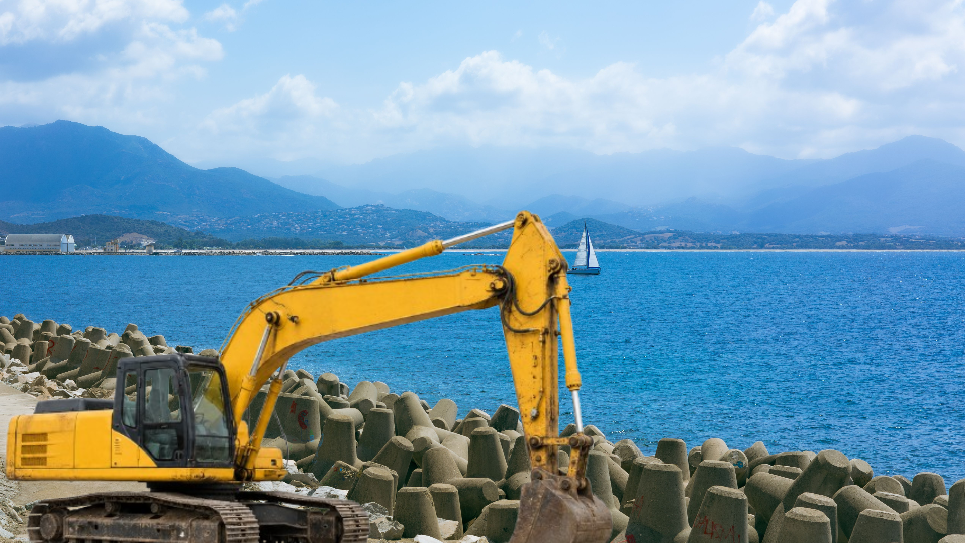 Escavadora em trabalhos de infraestrutura marítima junto ao mar
